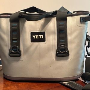 Yeti cooler - 20.5” at top 
13” tall.